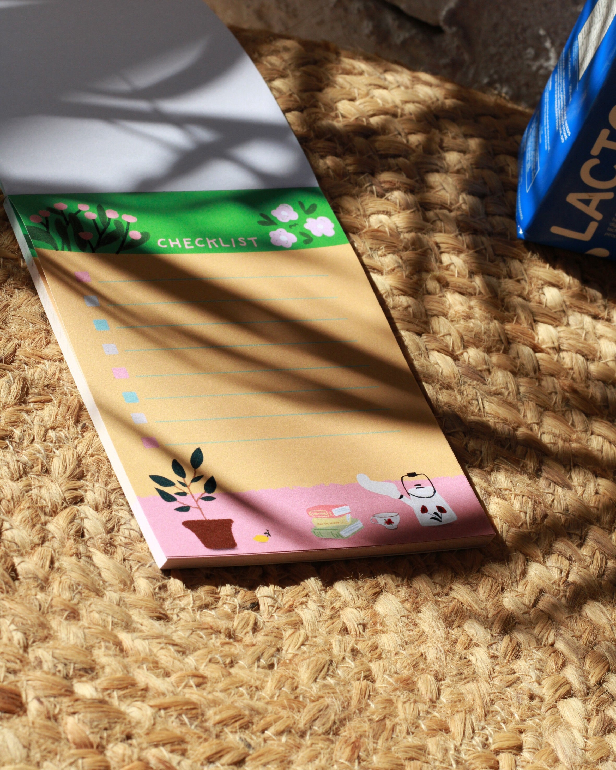 list-pad, notepad, in a multicolor floral illustration.